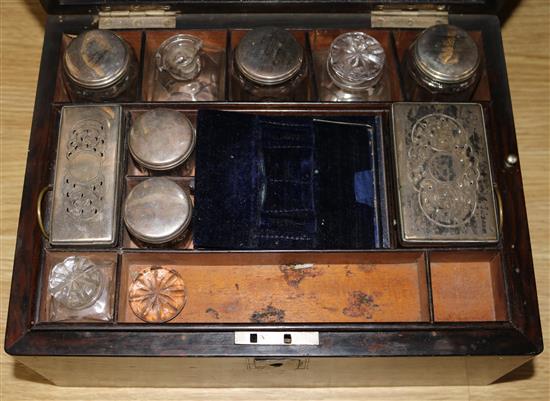 A Victorian mother of pearl-inlaid rosewood dressing case, with plate-mounted part fitments (some damage)